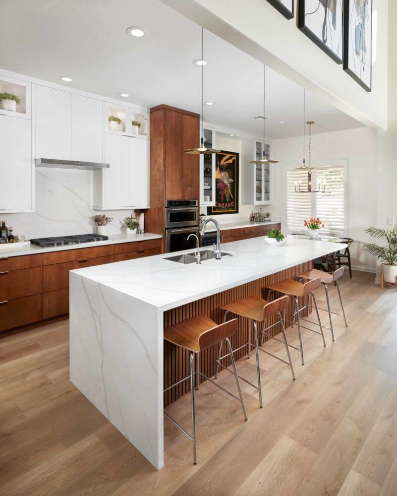 Side wrapped bertoli quartz island in newly remodeled kitchen - Dena Thomas Designs using Arizona Tile